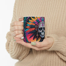 Load image into Gallery viewer, A hand holding a ceramic mug with a colorful geometric pattern design.