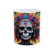Load image into Gallery viewer, A hand holding a ceramic mug with a colorful geometric pattern design.
