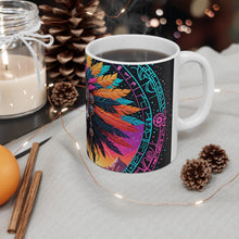 Load image into Gallery viewer, A hand holding a ceramic mug with a colorful geometric pattern design.