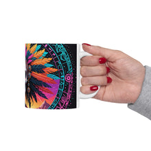 Load image into Gallery viewer, A hand holding a ceramic mug with a colorful geometric pattern design.