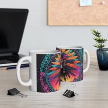 Load image into Gallery viewer, A hand holding a ceramic mug with a colorful geometric pattern design.
