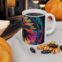 Load image into Gallery viewer, A hand holding a ceramic mug with a colorful geometric pattern design.