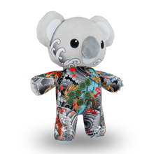 Load image into Gallery viewer, Plush toy koala with colorful tattoos on a white background