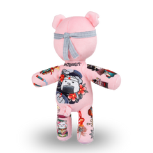 Load image into Gallery viewer, Pink plush toy with tattoo designs on a white background