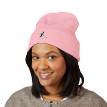 Load image into Gallery viewer, Person wearing a pink beanie with a logo on a white background