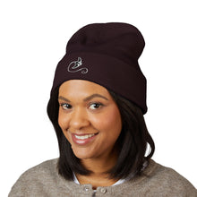 Load image into Gallery viewer, Woman wearing a dark brown beanie with a logo on a white background