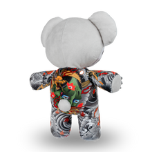 Load image into Gallery viewer, Gray teddy bear with a colorful patterned shirt on a white background
