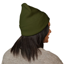 Load image into Gallery viewer, Person wearing a green beanie on a white background
