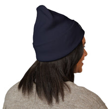Load image into Gallery viewer, Person wearing a navy blue beanie on a white background
