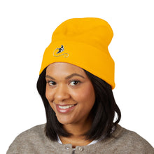Load image into Gallery viewer, Person wearing a yellow beanie with a logo on a white background
